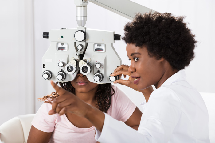 Young female with eye doctor